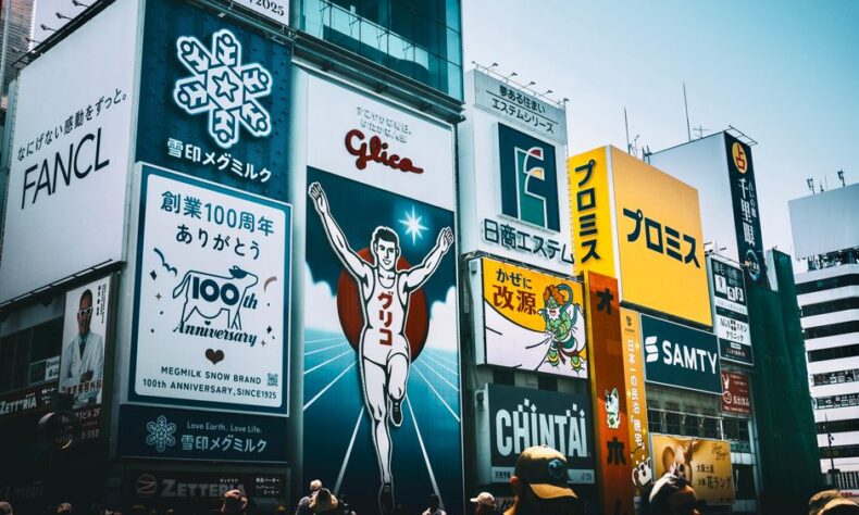 Colorful billboards and signs in a busy cityscape, capturing urban advertising. - Photo by Kuan-yu Huang on Pexels