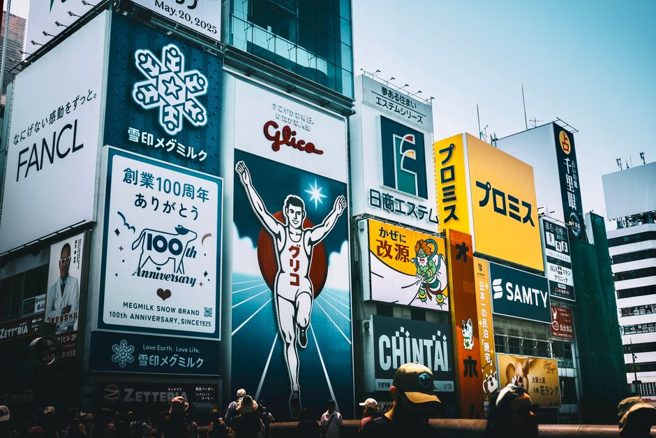 Colorful billboards and signs in a busy cityscape, capturing urban advertising. - Photo by Kuan-yu Huang on Pexels