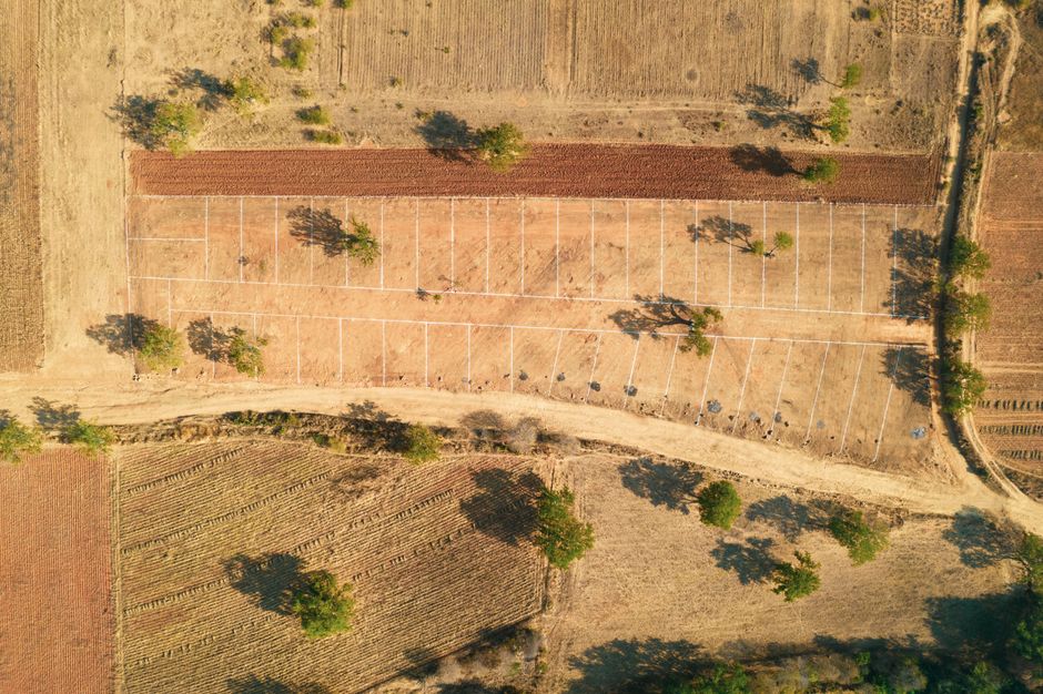 Drone shot of a rural farm landscape with fields and trees in summer. - Photo by Pexels User on Pexels